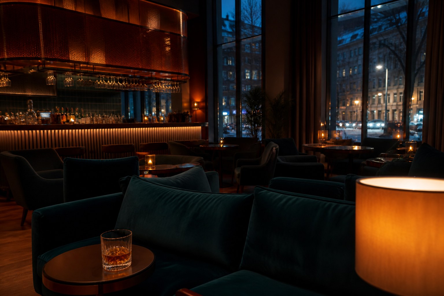 Helsinki hotel lounge at evening with harbour lights outside